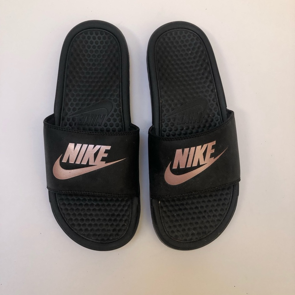 Women’s pink/black Nike slides. Size 8
